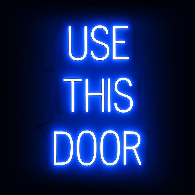 SpellBrite USE THIS DOOR Sign | Directional Sign with Neon Look, Blue LED Light Source | 17.4" x 23.8"