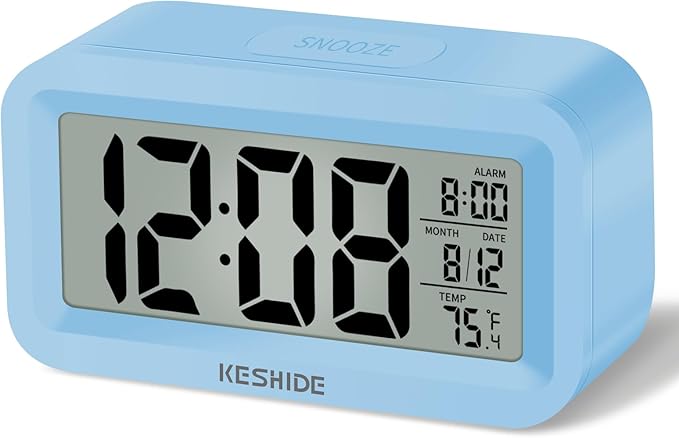 KESHIDE Travel Digital Alarm Clock Battery Operated with Indoor Temperature, Desk Small Clock,Snooze Model,12/24H Display for Bedrooms Heavy Sleepers Kids Travel Bathroom (Black)