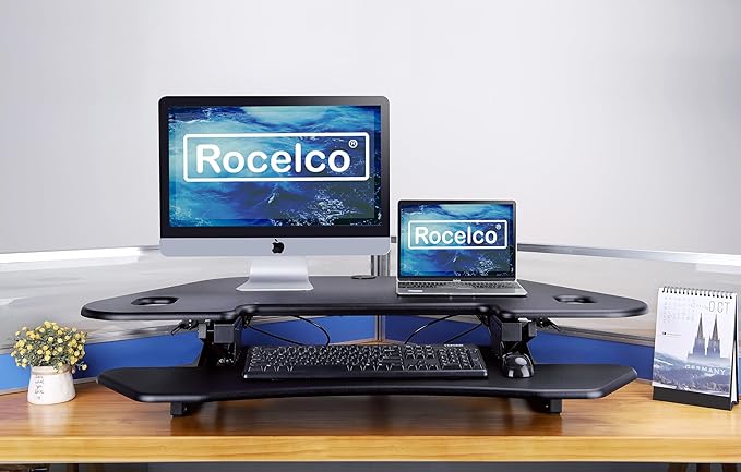 Rocelco 46" Height Adjustable Corner Standing Desk Converter with AC Outlet USB Charger and Anti-Fatigue Floor Mat - Sit Stand Up Tabletop Riser - Keyboard Tray - Black (R CADRB-46-ACUSB-MAFM)